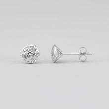 Charger l'image dans la galerie, A single round stud earring with a white  marbled pattern, shown next to its silver butterfly back on a textured white background.
